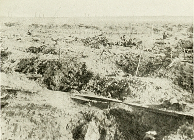 THE BATTLEFIELD OF "GINCHY." I WAS HURLED INTO THE TRENCH
IN THE FOREGROUND BY THE BURSTING OF A GERMAN SHELL, AND AWOKE
MANY HOURS LATER WITH SHELL SHOCK AND REALISED I HAD BEEN
LYING BESIDE A DEAD GERMAN ALL NIGHT. HE HAD BEEN THERE
I SHOULD SAY ABOUT THREE WEEKS