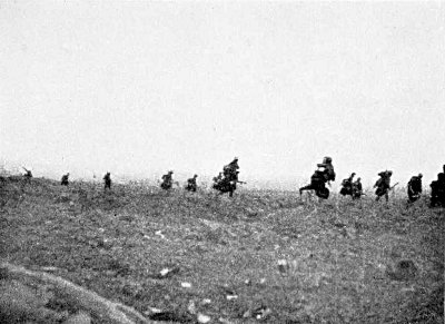 OVER THE TOP AT MARTINPUICH, SEPT. 15, 1916. I PHOTOGRAPHED
THIS SCENE AT 5.20 IN THE MORNING