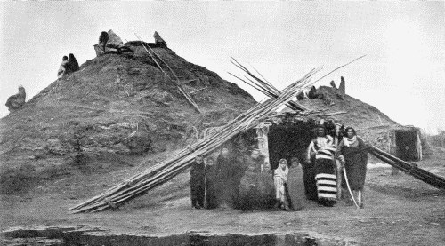 LODGES IN THE PAWNEE VILLAGE WHICH STOOD ON THE LOUPE FORK OF THE PLATTE RIVER

Photograph by W. H. Jackson, 1871