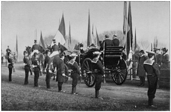 Sailors provide an honour guard as the King's carriage drives past