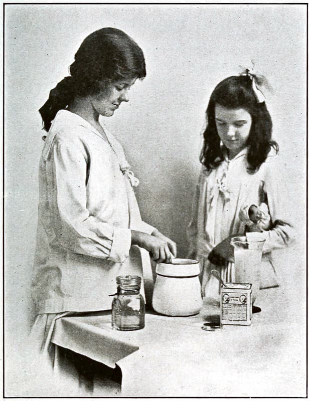 Two women preparing milk